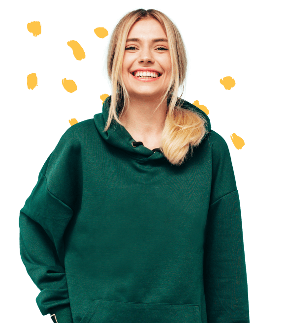 Aryan, the blonde, dressed in a green hoodie with a smile on her face
